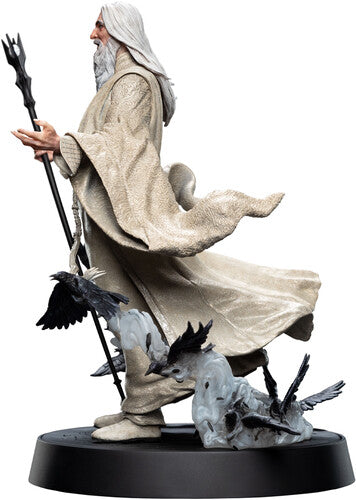 Detailed Saruman the White figure from The Lord of The Rings Trilogy by WETA Workshop, showcasing white robes and staff.